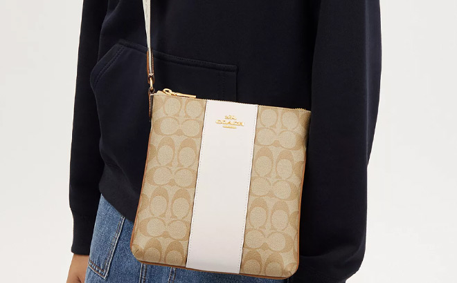 A Person Wearing Coach Mini Rowan File Bag A Person Wearing Coach Mini Rowan File Bag