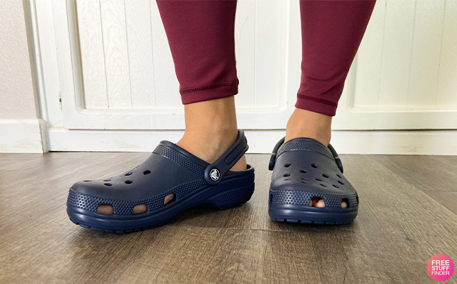 A Person Wearing Crocs Classic Clogs