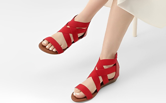 A Person Wearing Dream Pairs Womens Elastic Ankle Strap Sandals in Red Color