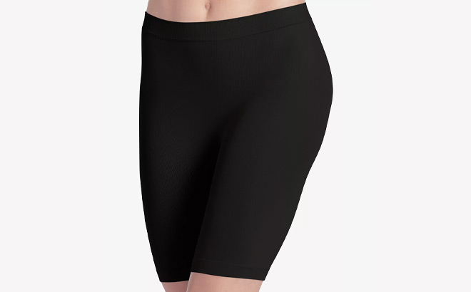 A Person Wearing Jockey Skimmies No Chafe Mid Thigh Slip Short in Black Color