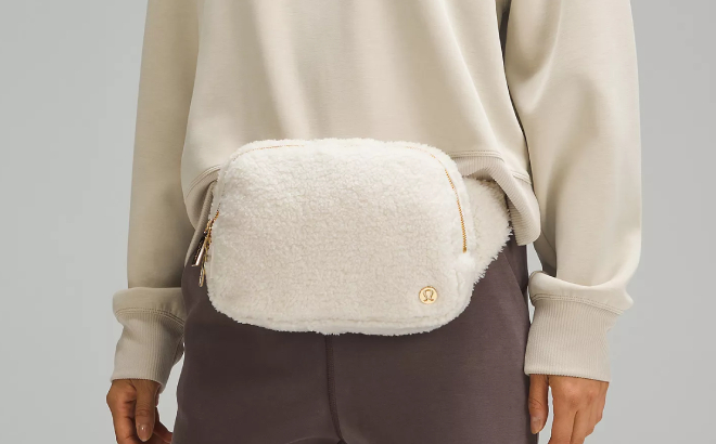 A Person Wearing Lululemon Everywhere Large Fleece Belt Bag