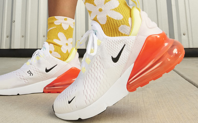 A Person Wearing Nike Air Max 270 Womens Shoes