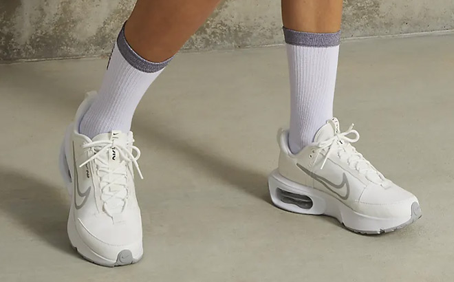A Person Wearing Nike Air Max INTRLK Womens Shoes
