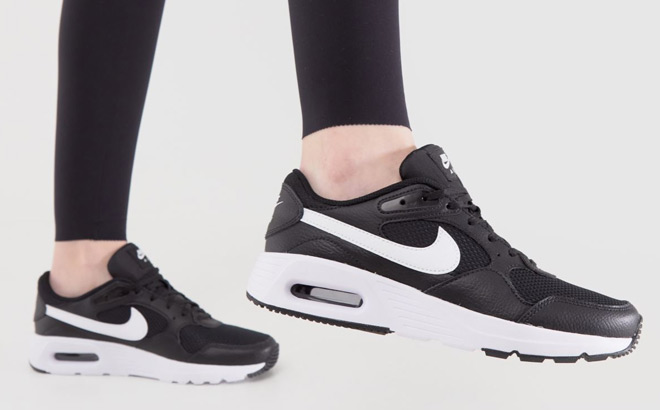 A Person Wearing Nike Air Max SC Womens Shoes
