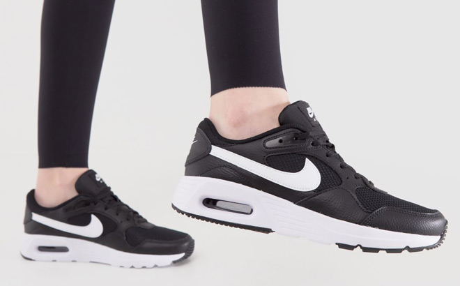A Person Wearing Nike Air Max SC Womens Shoes A Person Wearing Nike Air Max SC Womens Shoes