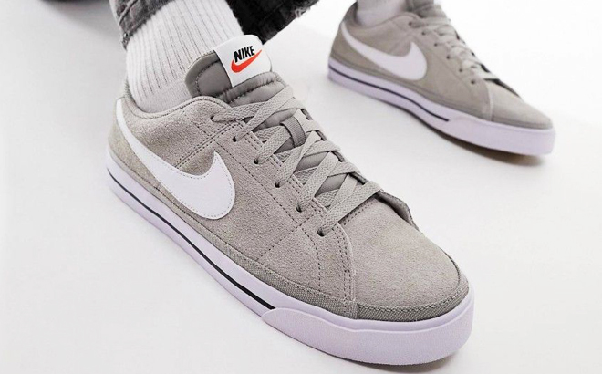 A Person Wearing Nike Court Legacy Suede Mens Shoes