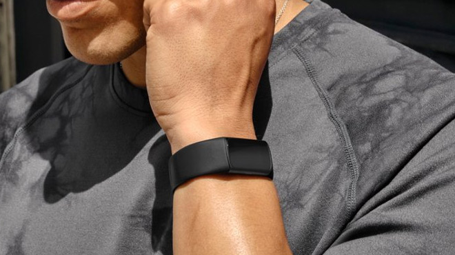 A Person Wearing a Fitbit Charge 6 Fitness Health Tracker on his Wrist