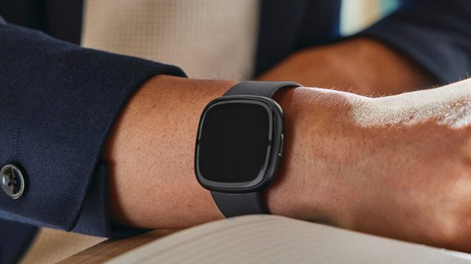 A Person Wearing a Fitbit Sense 2 Health Smartwatch on his Wrist