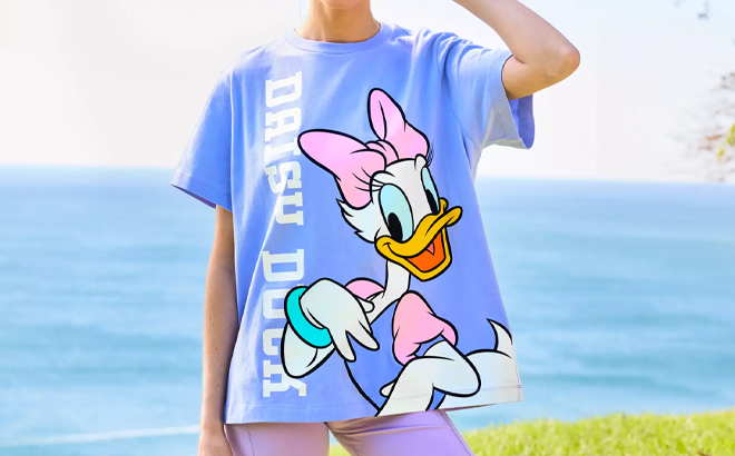 A Person Wearing the Disney Daisy Duck Back to Front T Shirt