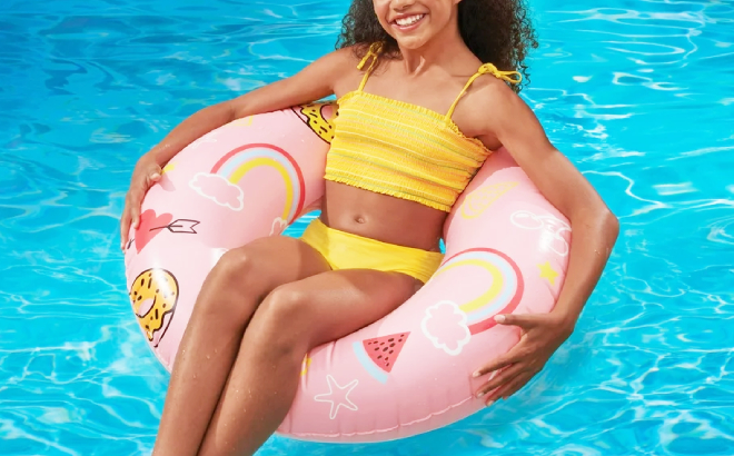 A Person on Bluescape Pink Sweets Inflatable Swim Tube Pool Float