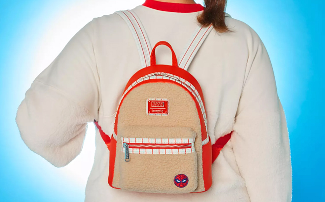 A Person with a Spider Man Faux Fur Loungefly Mini Backpack