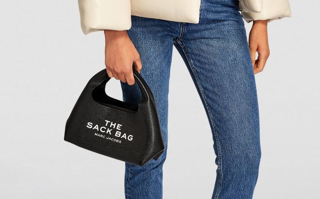 A Woman Holding Marc Jacobs The Mini Sack Bag