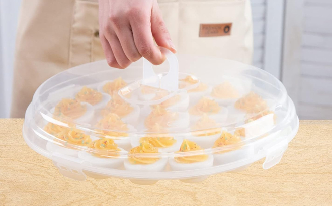 A Woman Holding the Hansgo Egg Platter with Lid