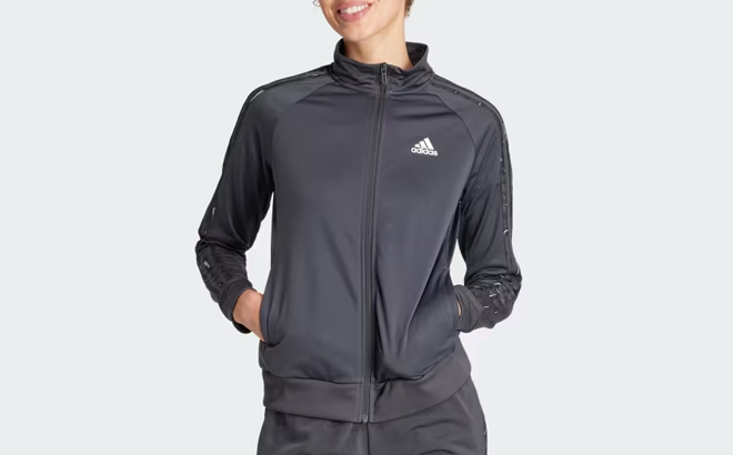 A Woman Wearing Adidas Essentials Animal Print Tricot 3 Stripes Track Jacket
