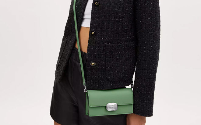 A Woman Wearing Coach Outlet Eliza Small Flap Crossbody Bag A Woman Wearing Coach Outlet Eliza Small Flap Crossbody Bag