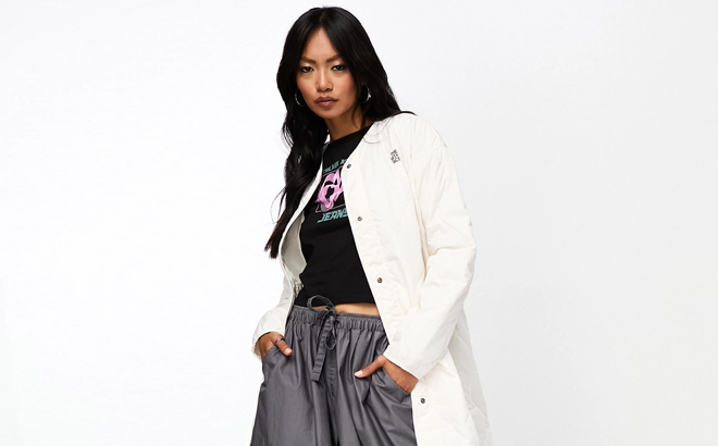 A Woman Wearing The North Face Womens Quilted Longline Jacket