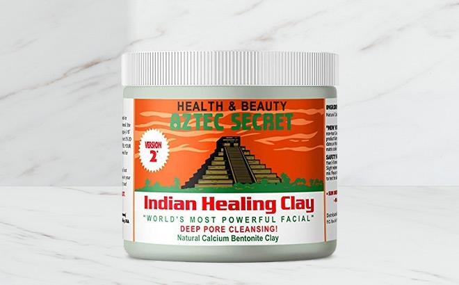 Aztec Secret Deep Pore Cleansing Facial Body Mask on the Table