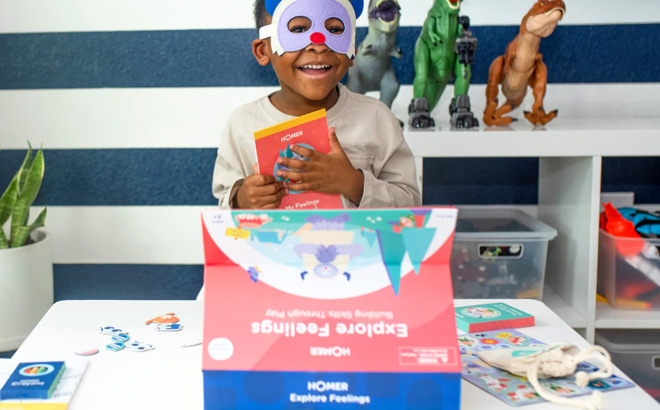 Boy with a Mask Using a Homer Explore Feelings Kit