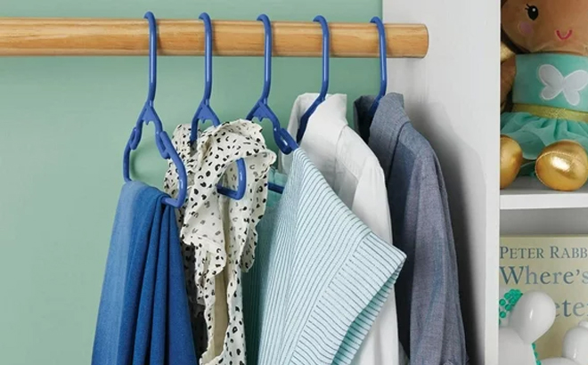 Childrens Clothing Hanging on Your Zone Clothing Hangers in the Color Blue in a Closet