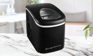 Frigidaire 26 lb Retro Bullet Ice Maker in the Color Black on a Kitchen Counter