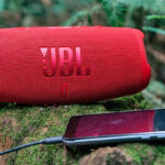 JBL Charge 5 Portable Waterproof Speaker with Powerbank Connected to a Phone