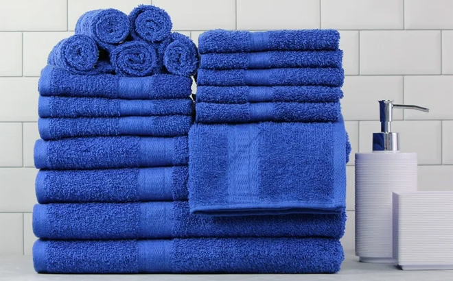 Mainstays Basic Solid 18 Piece Bath Towel Set in the Color Royal Spice on a Bathroom Counter