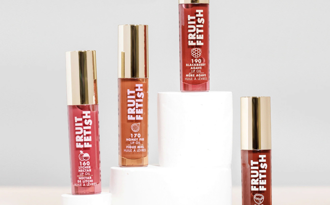Milani Fruit Fetish Lip Oils on a Product Display Stand