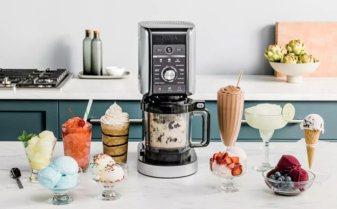 Ninja Creami Deluxe Ice Cream Frozen Treat Maker on a Table with Ice Creams and Frozen Treats Ninja Creami Deluxe Ice Cream Frozen Treat Maker on a Table with Ice Creams and Frozen Treats