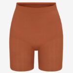 Skims Mid Thigh Shorts in bronze color