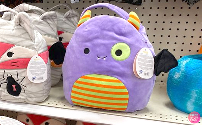 Squishmallows Blaze Monster Halloween Treat Pail Plush on a Shelf Squishmallows Blaze Monster Halloween Treat Pail Plush on a Shelf