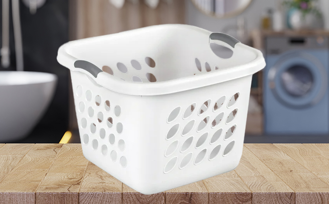 Sterilite 1 5 Bushel Ultra Square Laundry Basket in the Color White on a Bathroom Counter