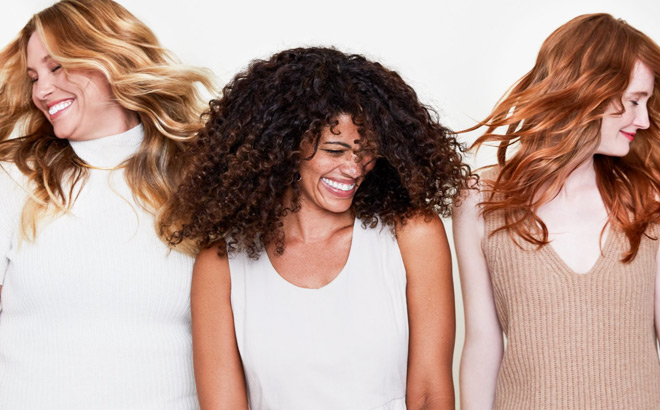 Three Women Smiling and Showing Their Radiant Hair