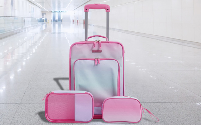 Travelers Club Juniors 3 Piece Soft Side Junior Travel Luggage Set on Airports Floor