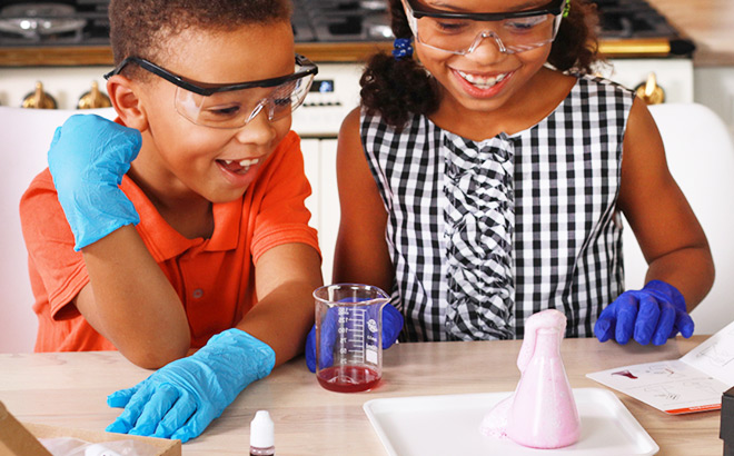 Two Kids Doing a Fun Experiment with Mel Science Chemistry Kit Two Kids Doing a Fun Experiment with Mel Science Chemistry Kit