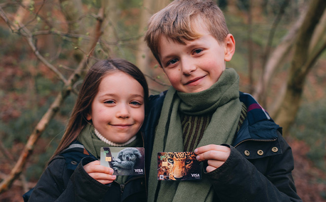 Two Kids Holding Kids Debit Cards