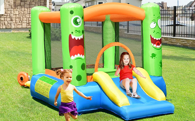 Two Kids Playing on Costway Inflatable Bounce House Jumper