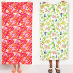 Two Men Holding Outtek Printed Beach Towels