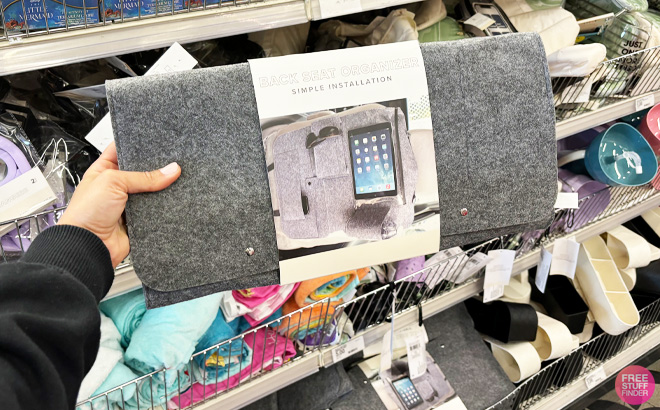 a Person Holding Back Seat Organizer 1