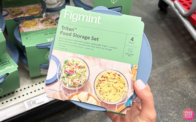 a Person Holding Figmint Tritan Plastic Food Storage Bowls with Lids 4 Piece Set