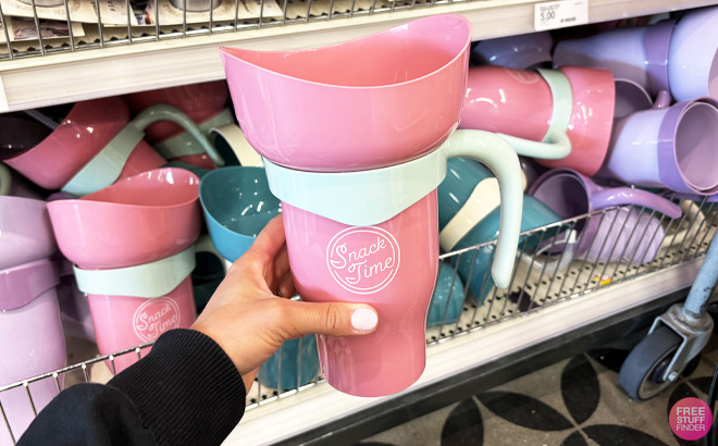 a Person Holding Pink Snack Tumbler a Person Holding Pink Snack Tumbler