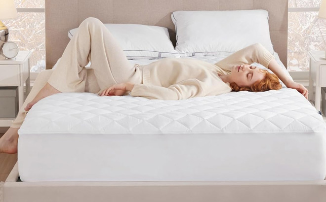 a Person Lying on a Bed with Waterproof Mattress Protector