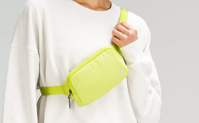 a Person Wearing Lululemon Everywhere Belt Bag Mini Ripstop