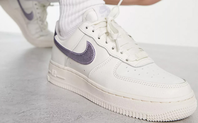 a Person Wearing Nike Air Force 1 07 ESS Sneakers