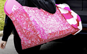 a Woman Holding a T Mobiel Oversized Tote