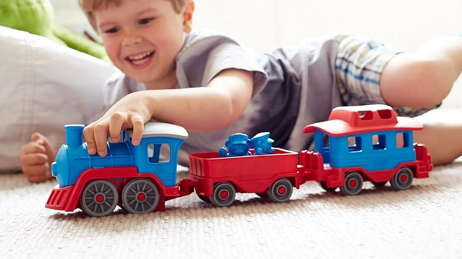 A Boy PLaying Green Toys Train A Boy PLaying Green Toys Train
