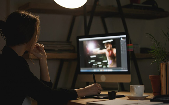 A Girl Editing a Video on a Computer