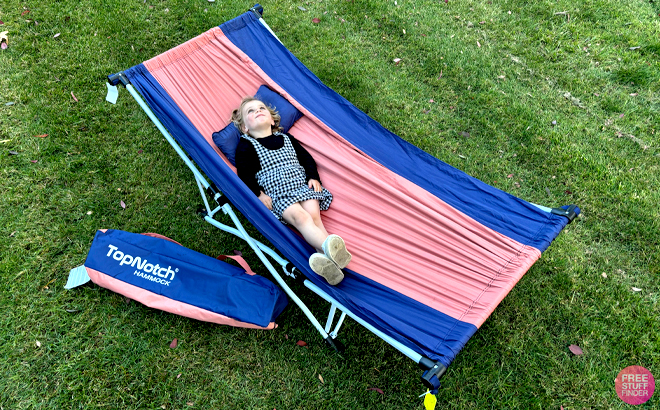 A Girl Laying on the MacSports Portable Hammock with Carrying Case