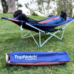 A Man Laying on the MacSports Portable Hammock with Carrying Case