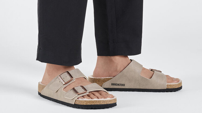 A Man Wearing Birkenstock Arizona Shearling Slide Sandals