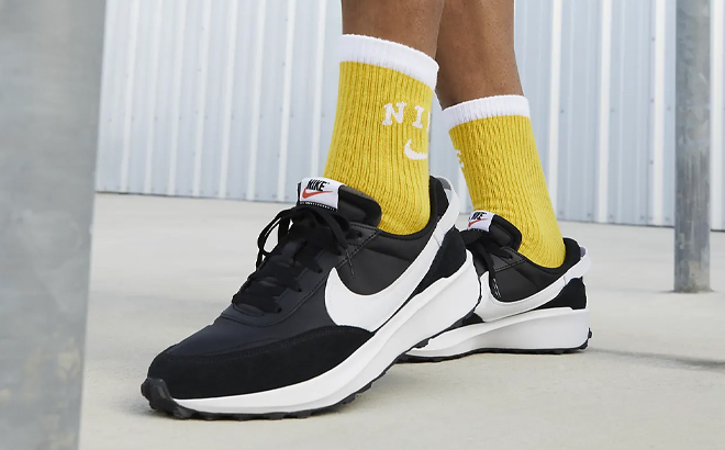 A Man Wearing Nike Waffle Debut Running Shoes 1